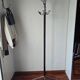 Chrome parrot coat rack with swivel head on a gas lift.