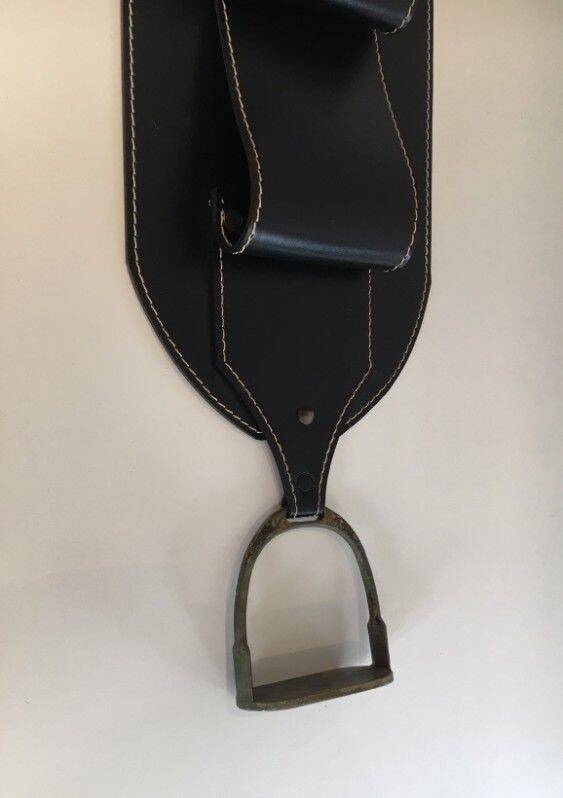 Leather wall-mounted magazine rack. Attributed to Jacques Adnet