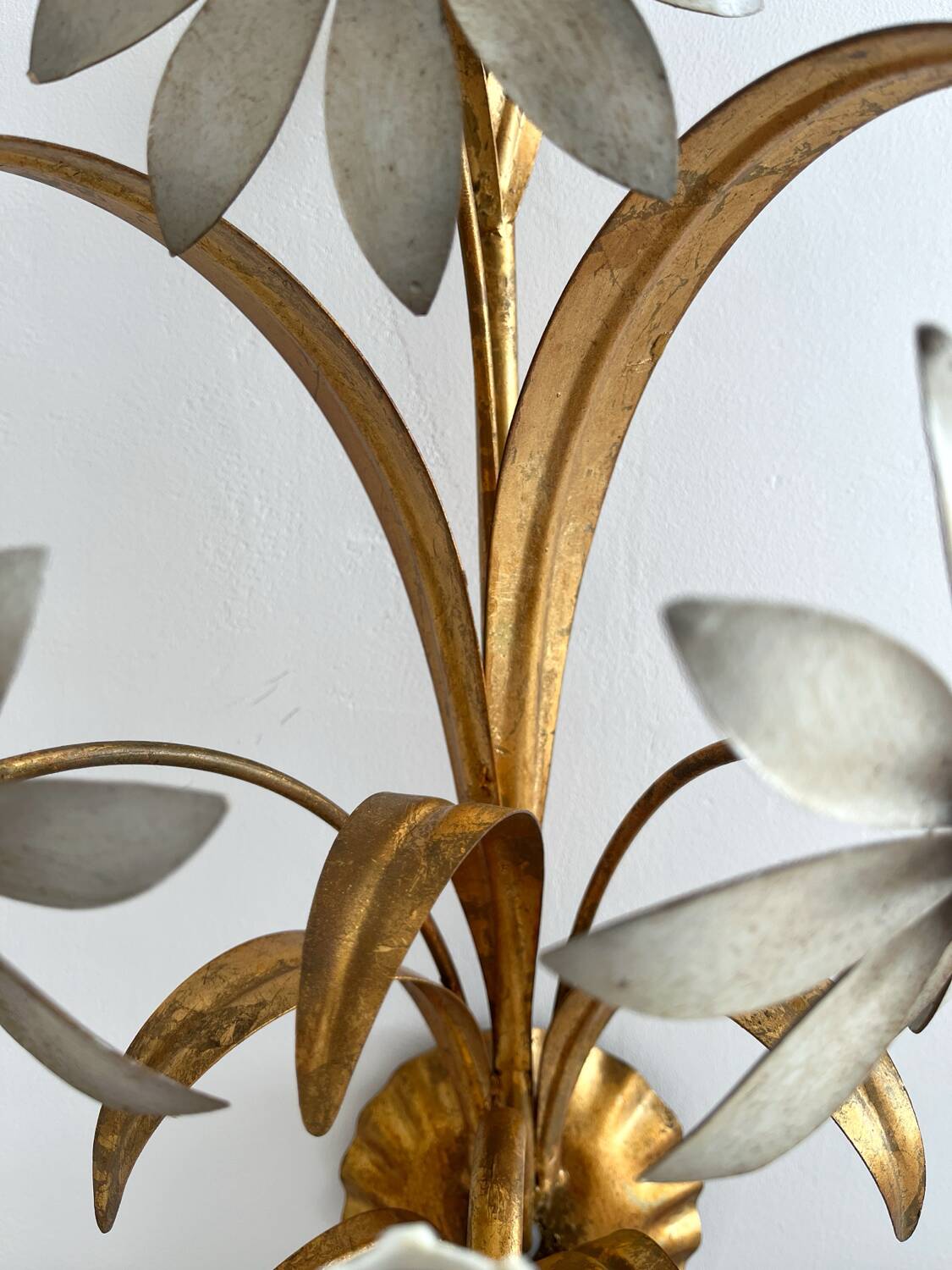 Vintage Hollywood Regency gold metal leaf wall sconce.