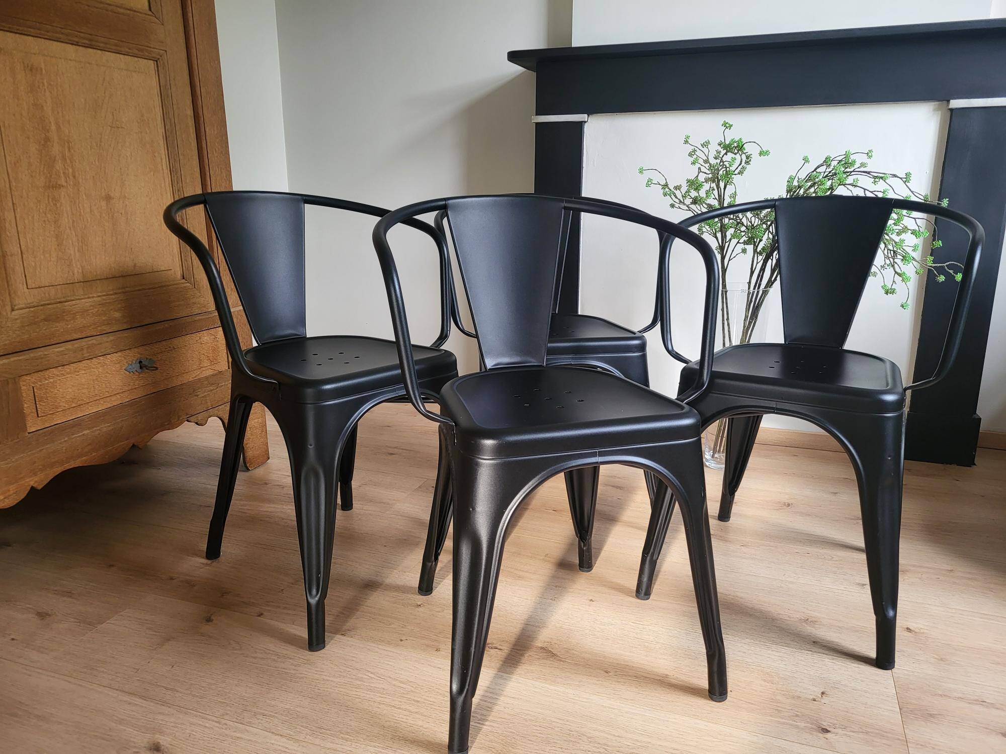 Black Tolix chair with armrests