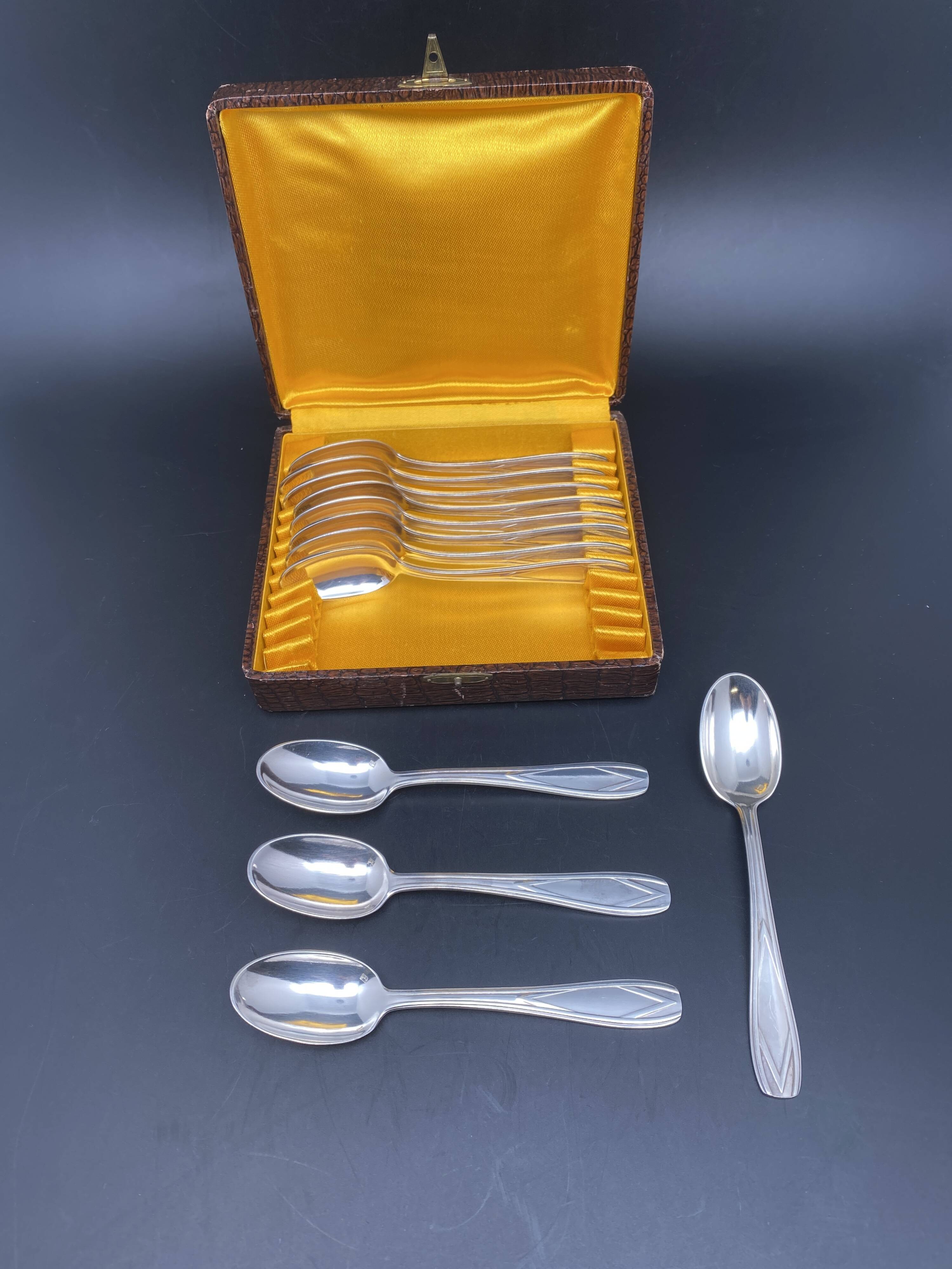 Dessert spoons in silver-white metal