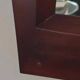 Grand miroir mural en bois exotique massif