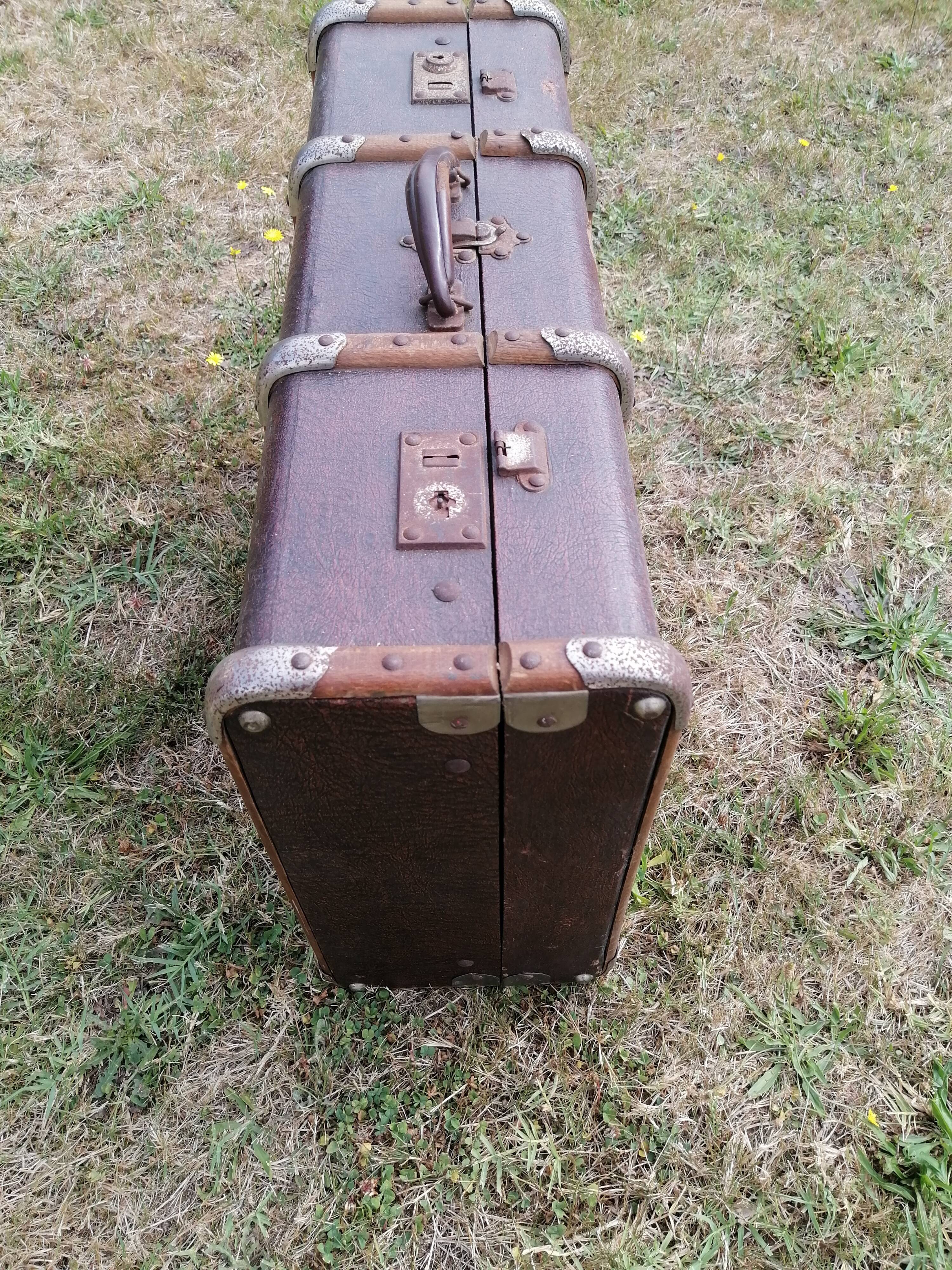 Antique suitcase in leather wood and vintage metal