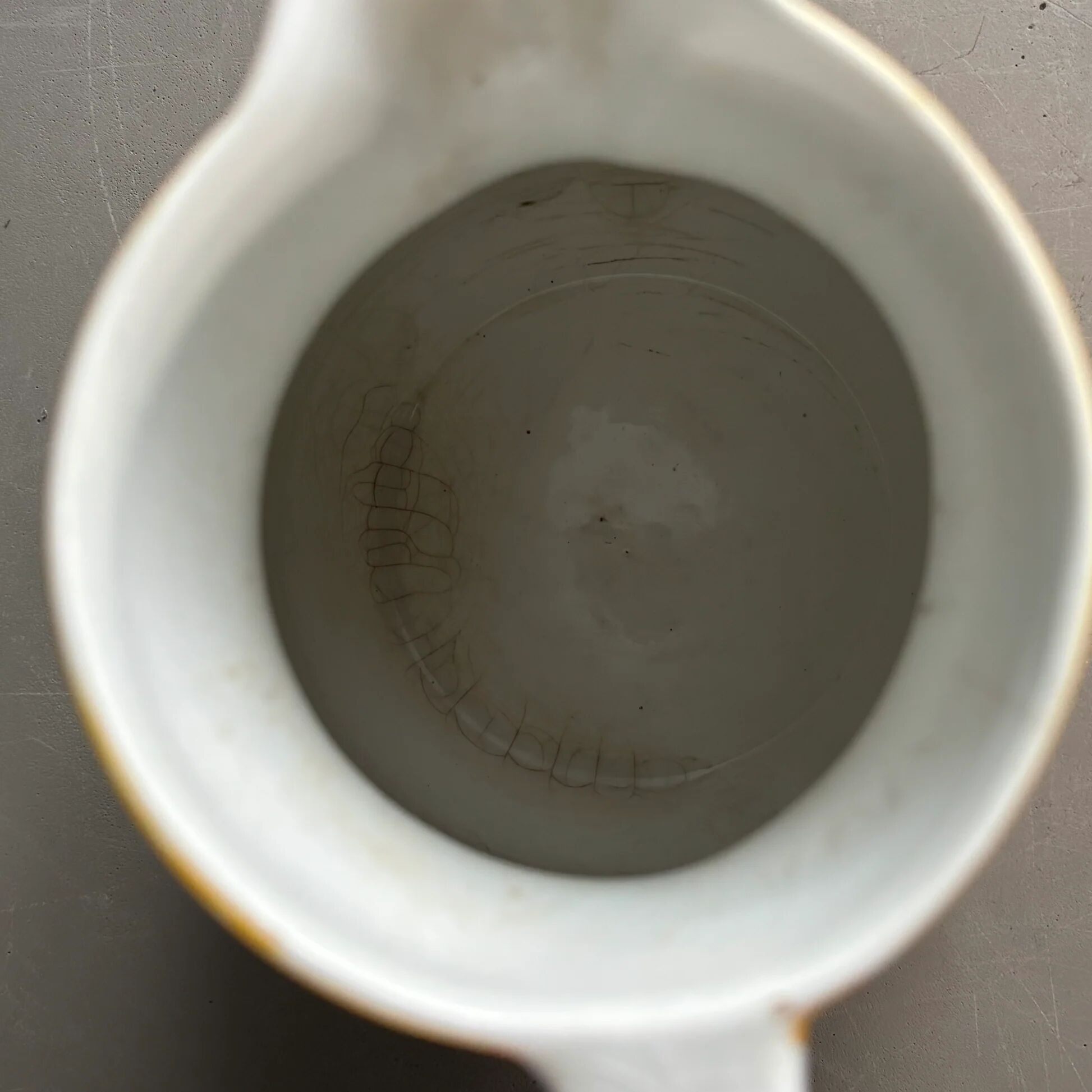 Antique teapot in earthenware with a tin filter lid.
