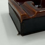 Geometric brown enamelled ashtray with a leather base (1960s-70s)