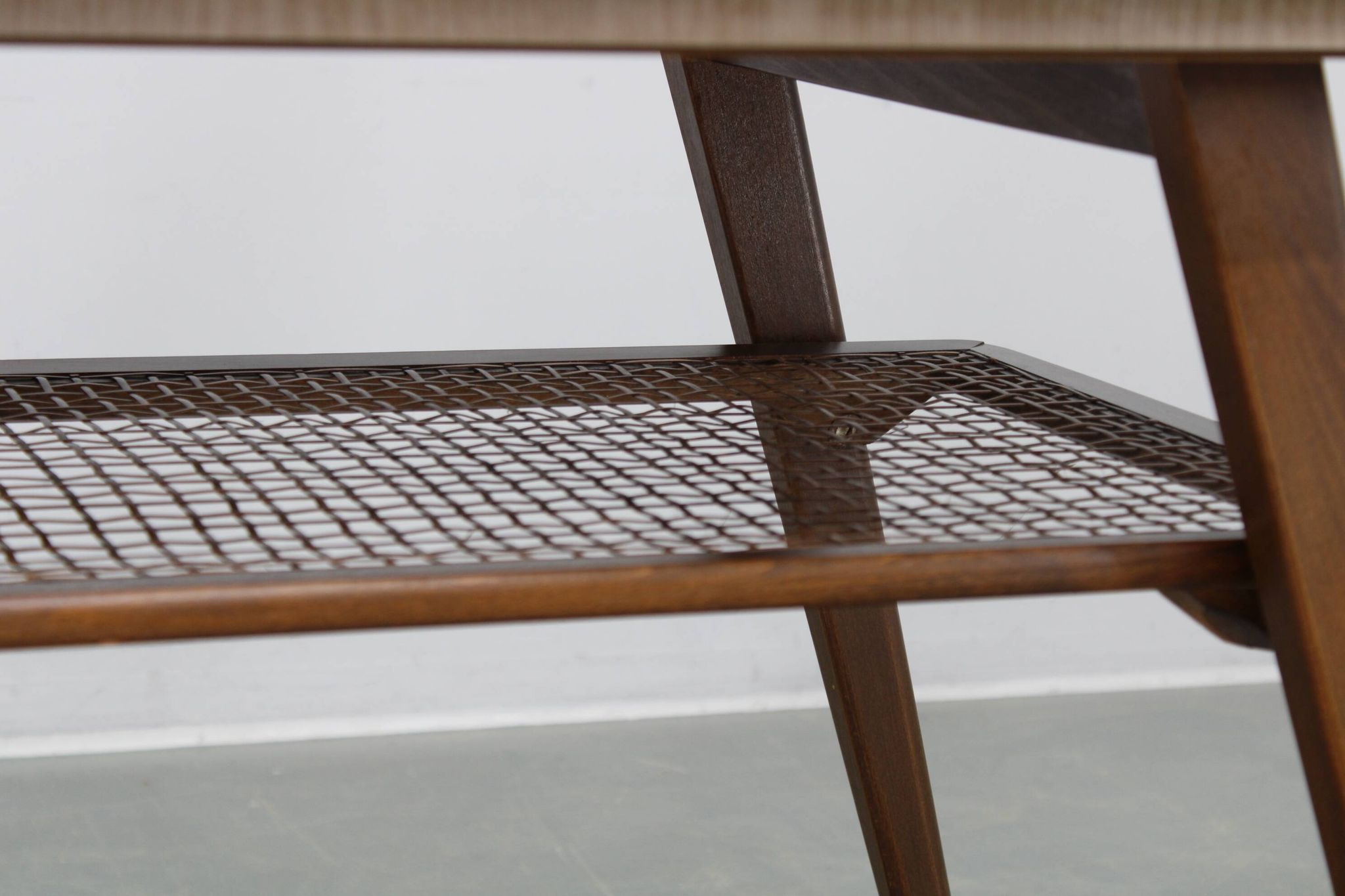 Mid-century German coffee table with rattan shelf and brass legs