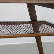 Mid-century German coffee table with rattan shelf and brass legs