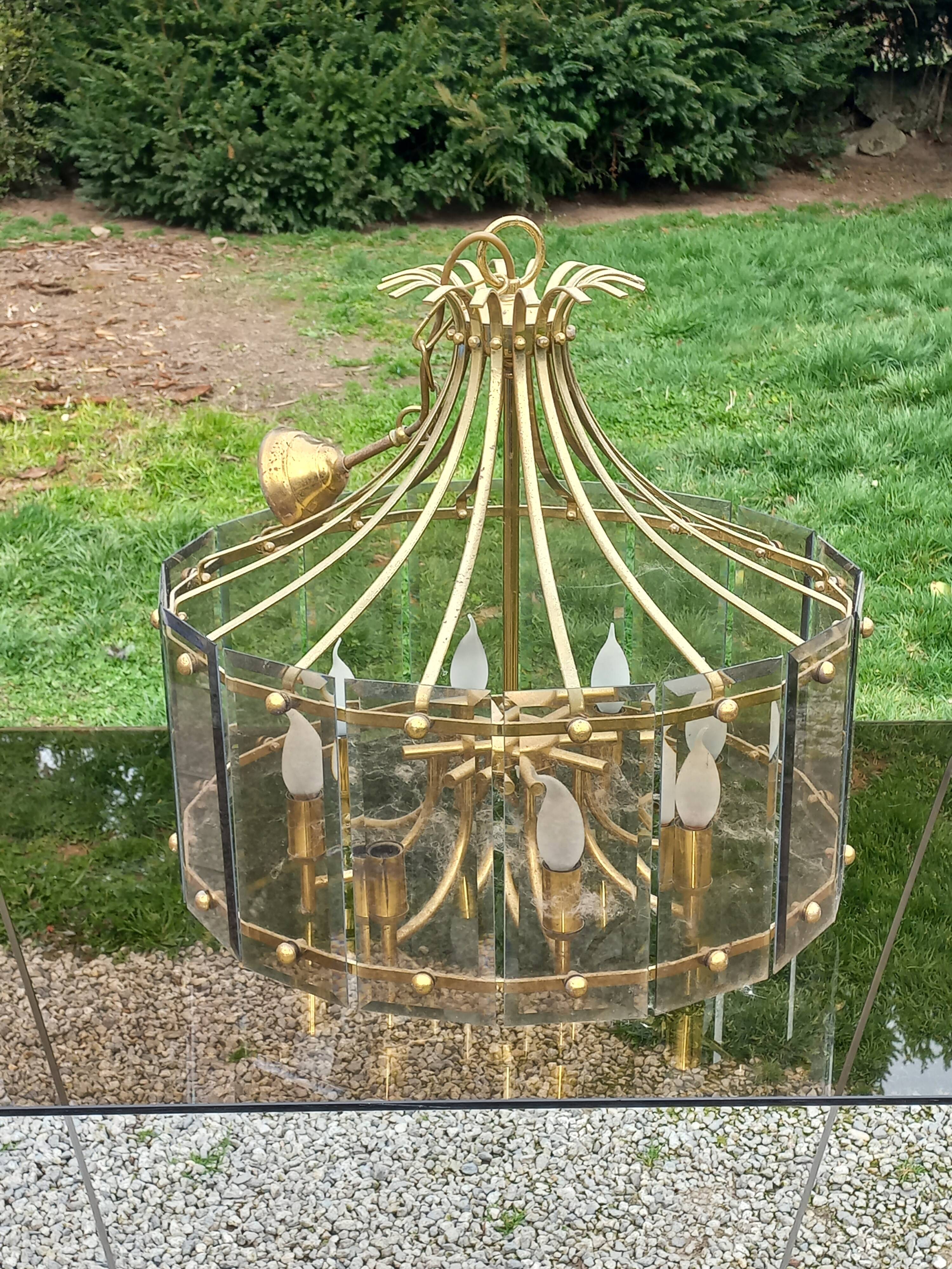 70s designer chandelier with smoked glass plates and gold metal frame