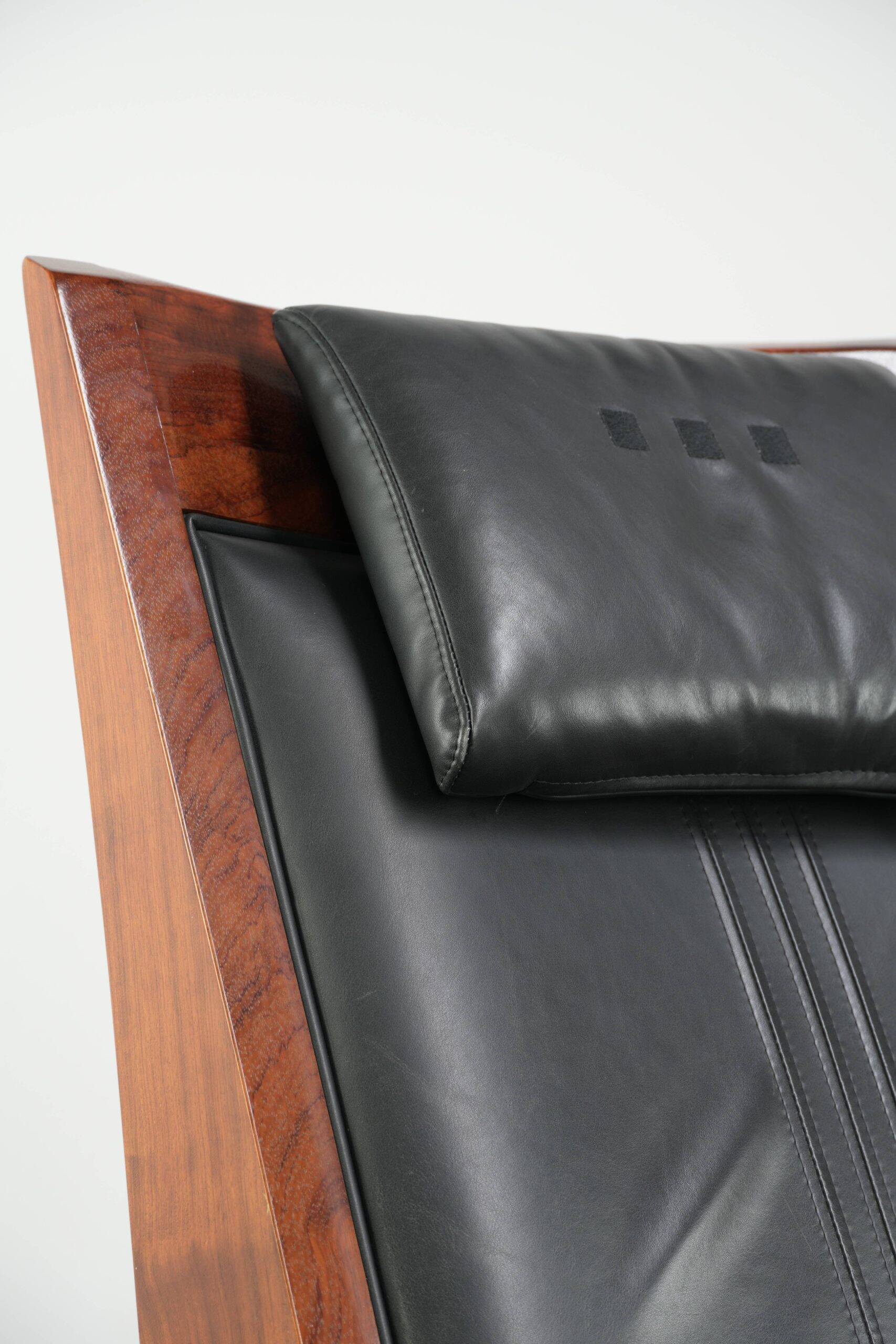 Electrically adjustable Art Deco design recliner with black cowhide leather