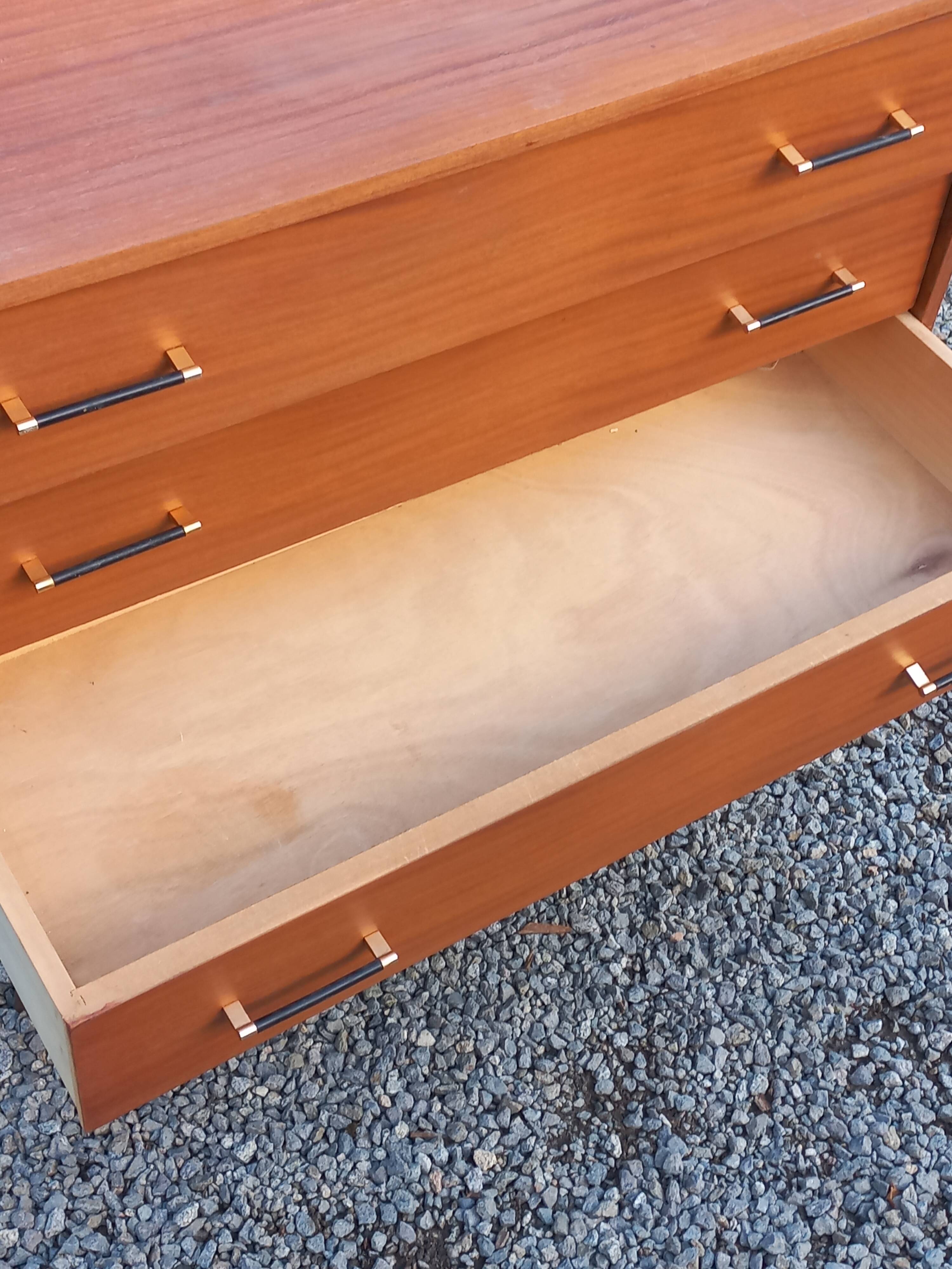 Vintage mahogany commode with metal tapered legs, 4 drawers, 1950s.