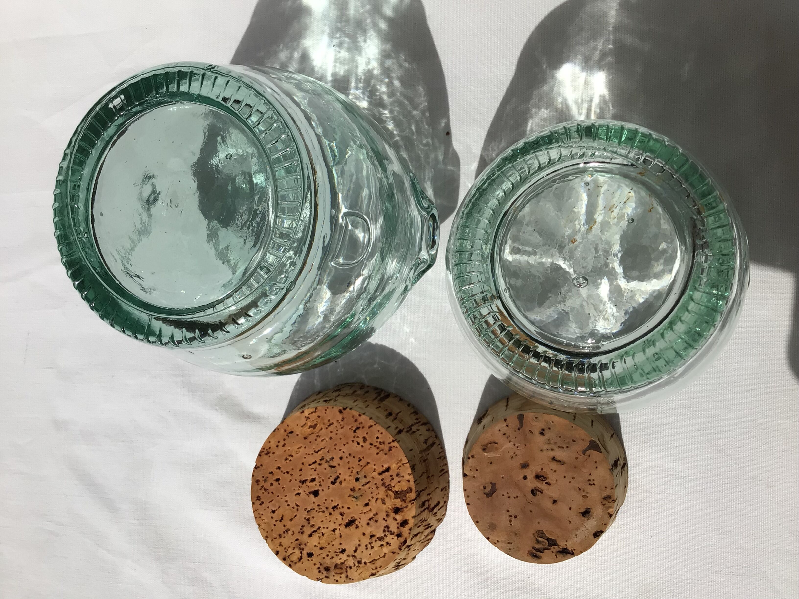 2 jars light green glass molded cork stopper