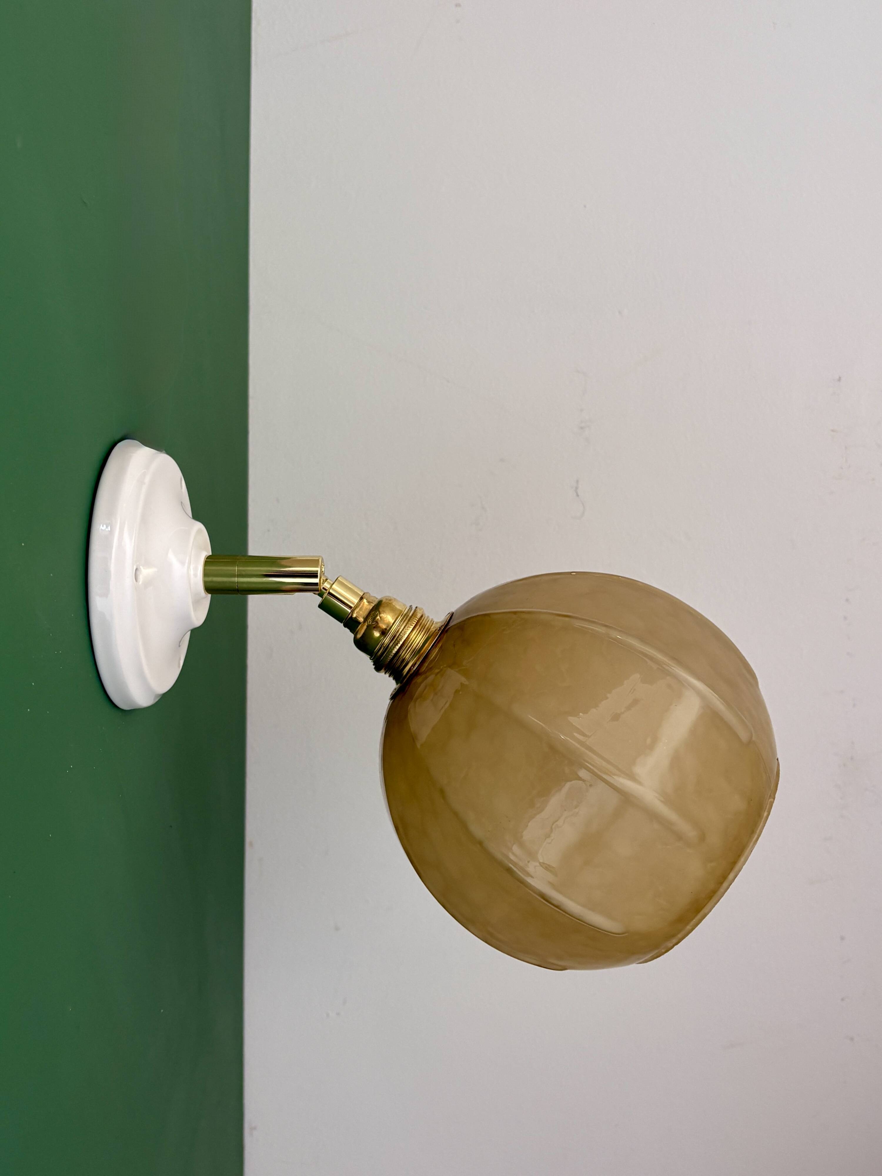 Vintage yellow glass globe wall light
