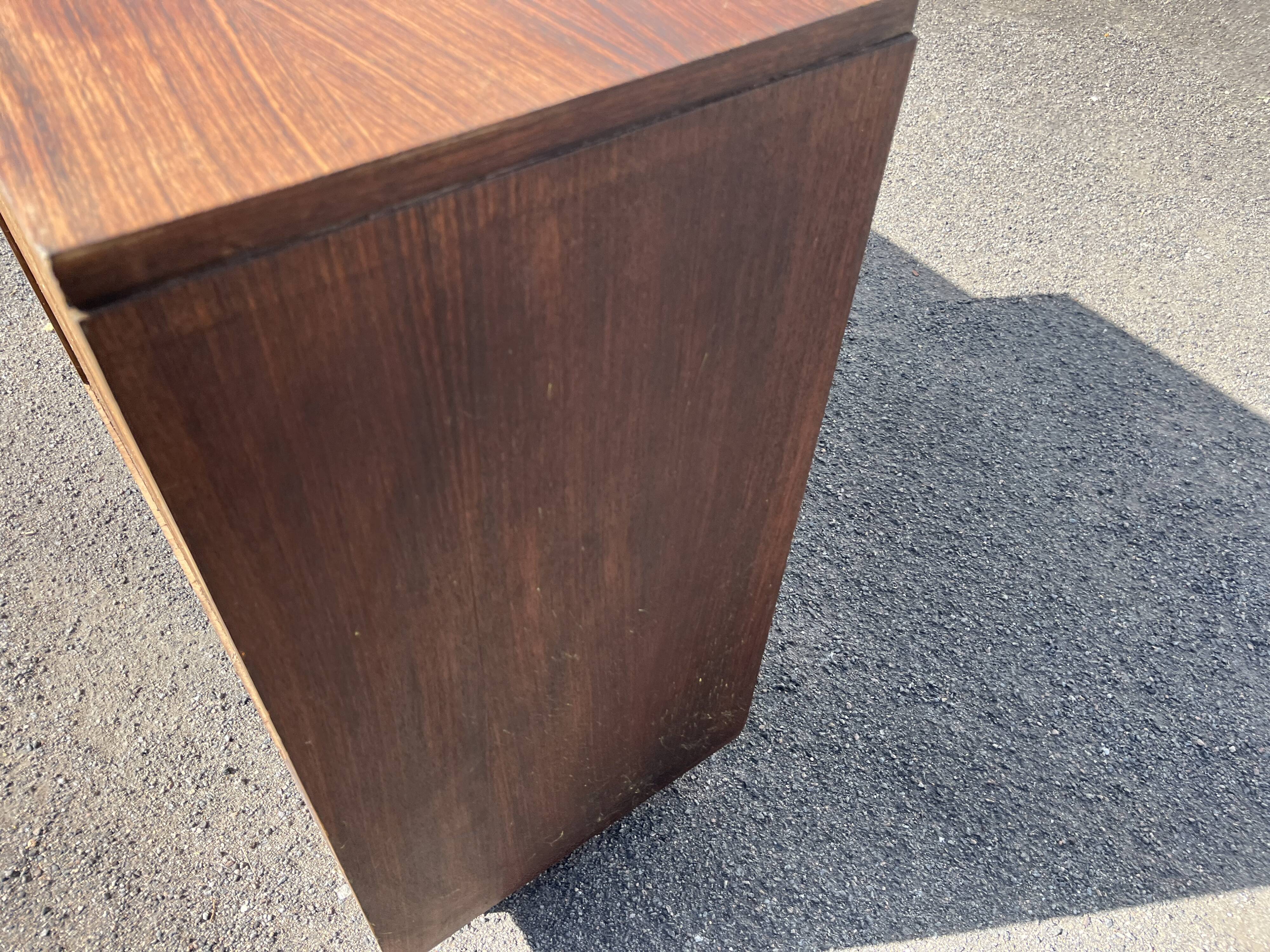 Asymmetrical antique Art Deco sideboard in rosewood veneer.
