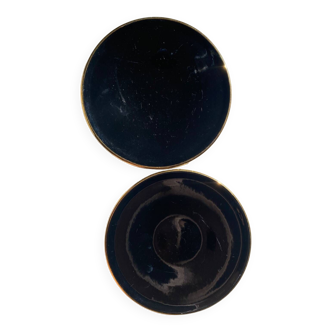 2 black Magdalena plates with gold edging from the 1950s