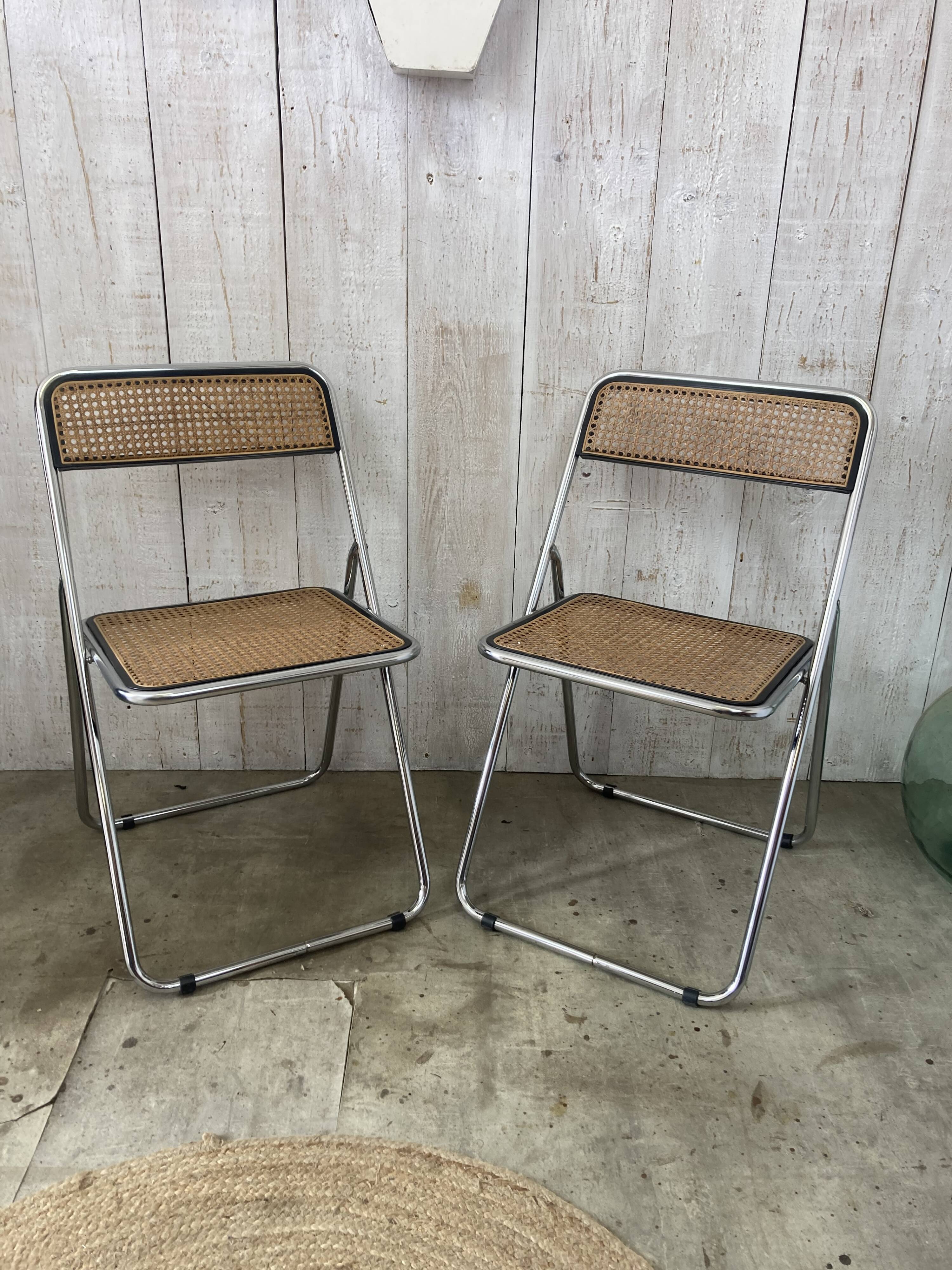 Pair of chrome and cane folding chairs