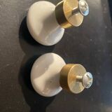 a pair of small antique porcelain and brass knob handles
