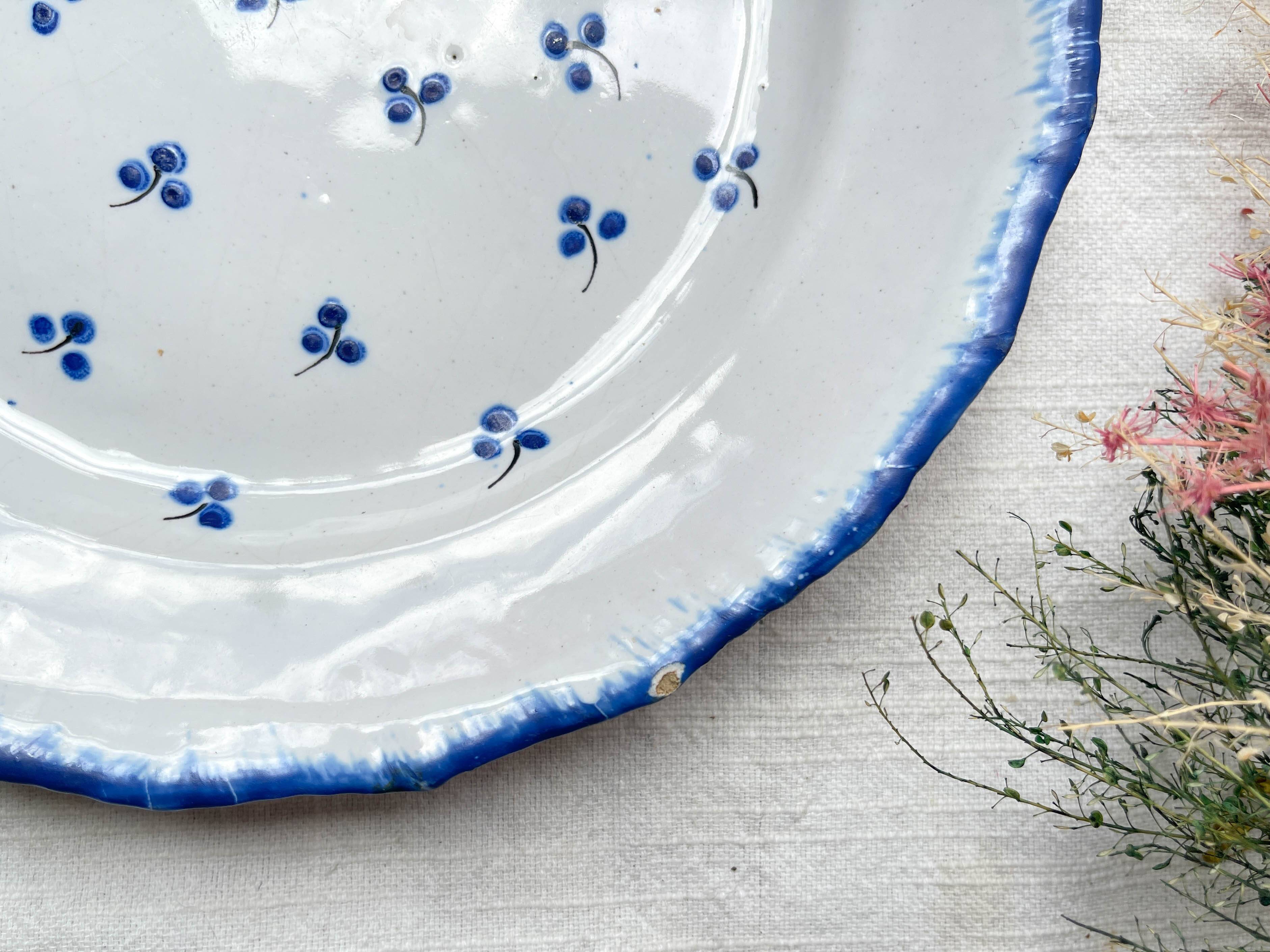 Antique French Earthenware Plate from the 19th century with small blue flower motif