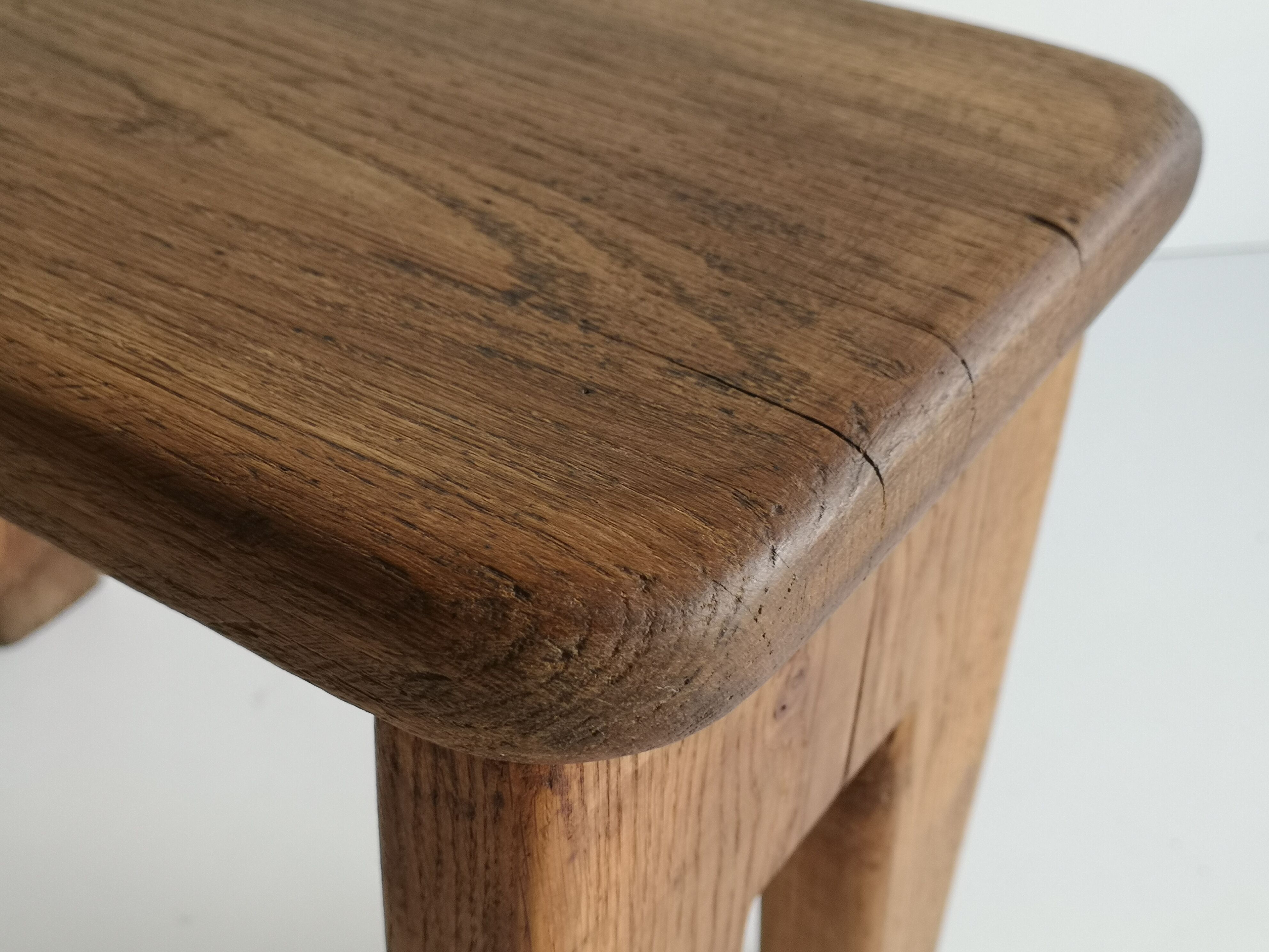 Small low stool in solid oak