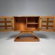 Mid-century modern mobile bar cabinet with sculptural base, 1950s.