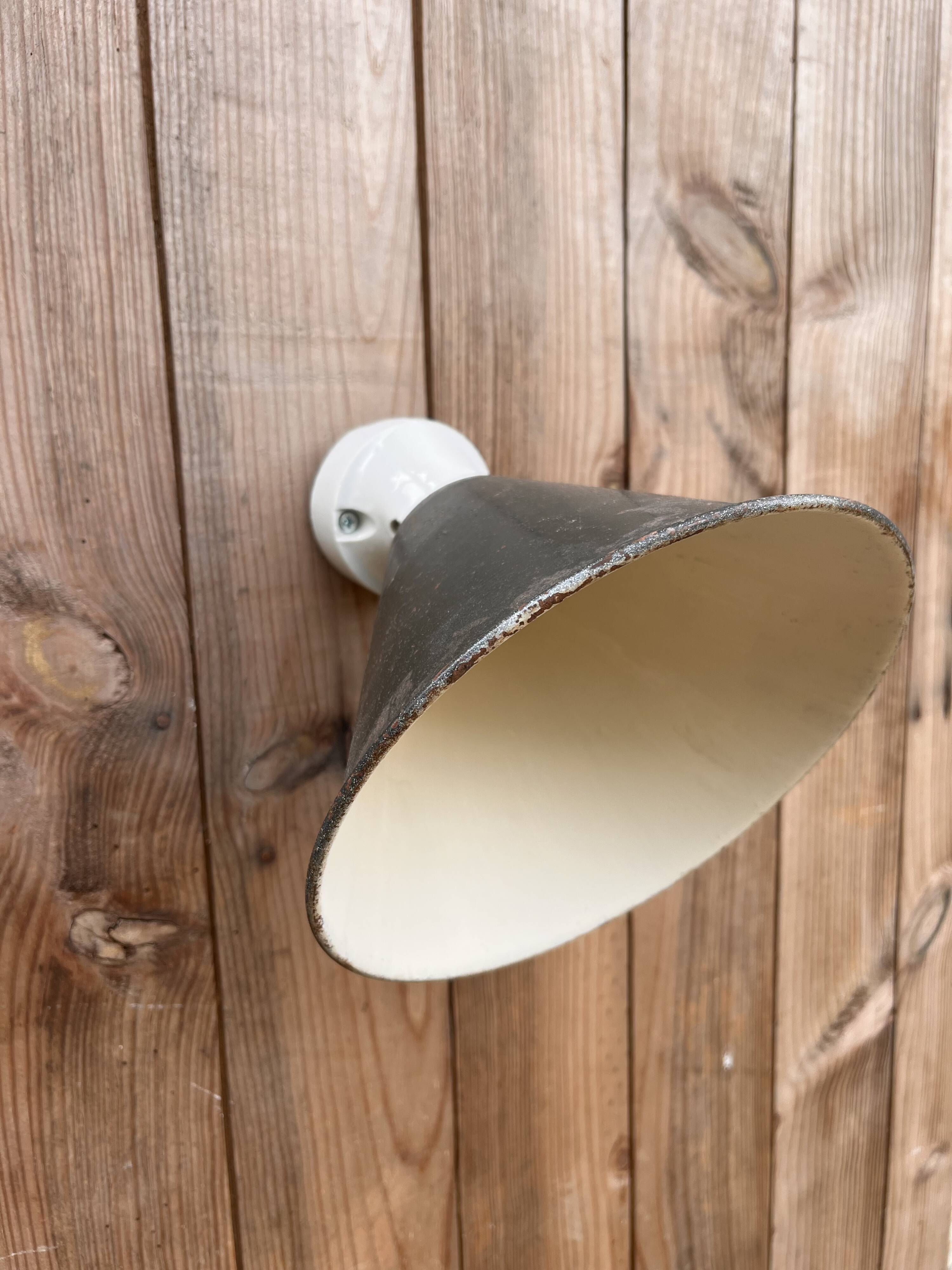 Conical wall light on porcelain base