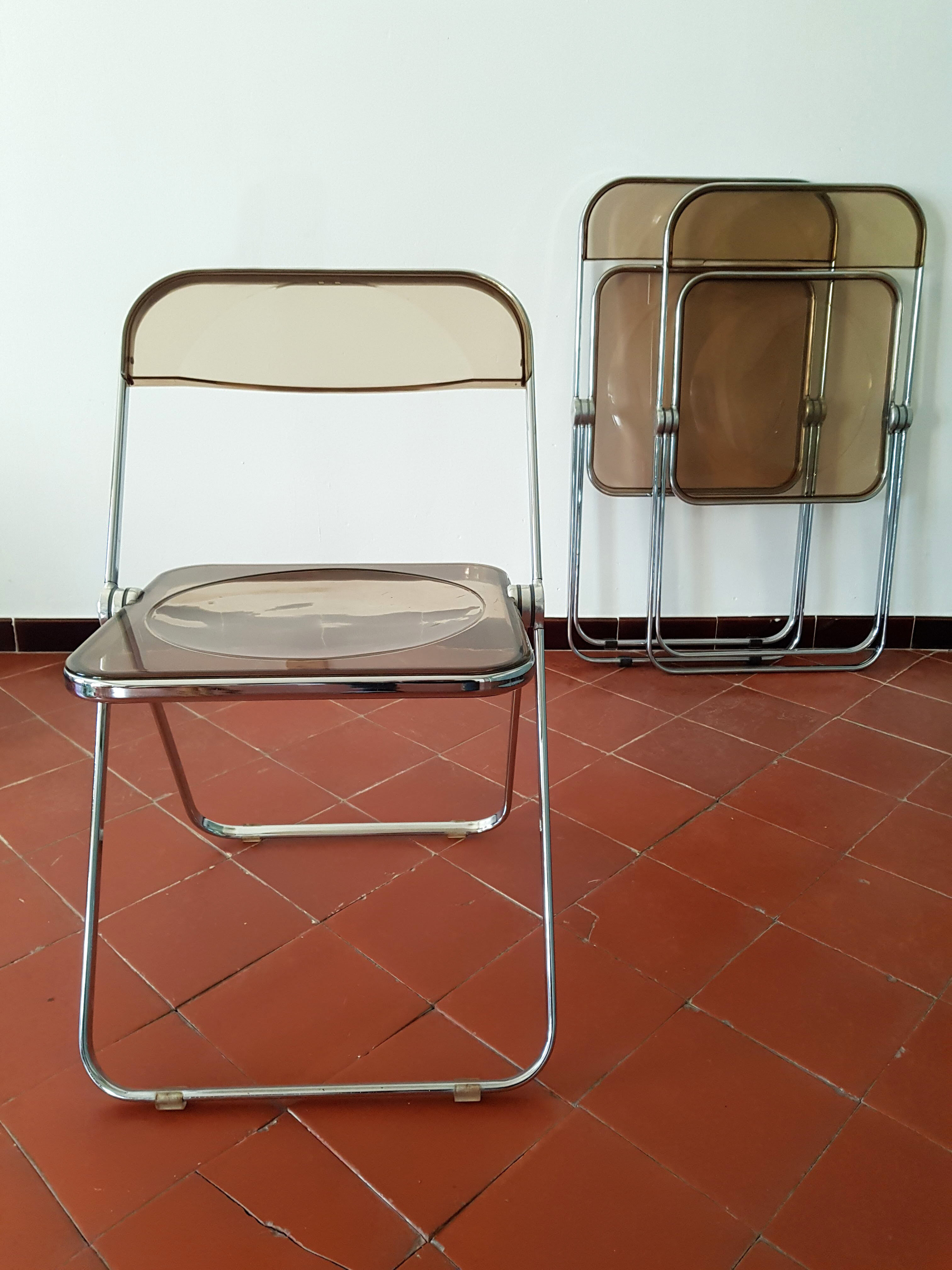 Trio of chairs folded Castelli design Giancarlo company