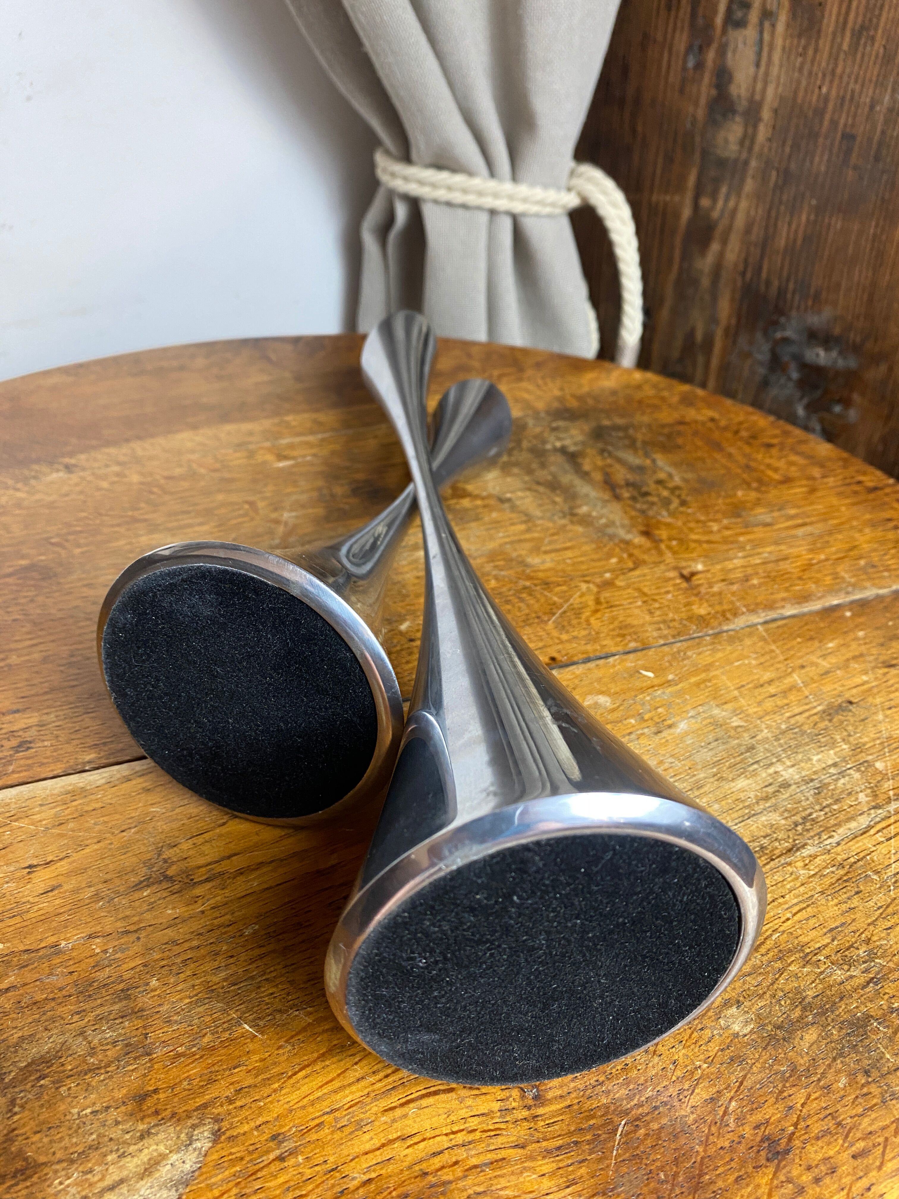 Pair of designer candle holders in stainless steel