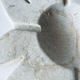 Travertine fish pocket emptier