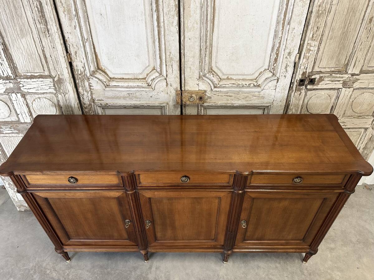 Louis XVI style enfilade in cherry wood, 20th century.