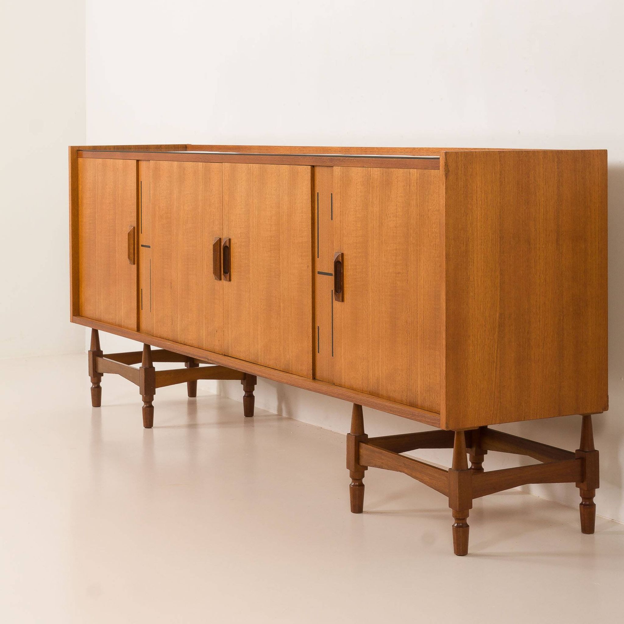 Itaian mid century teak sideboard with black glass top and inlays, 1970s