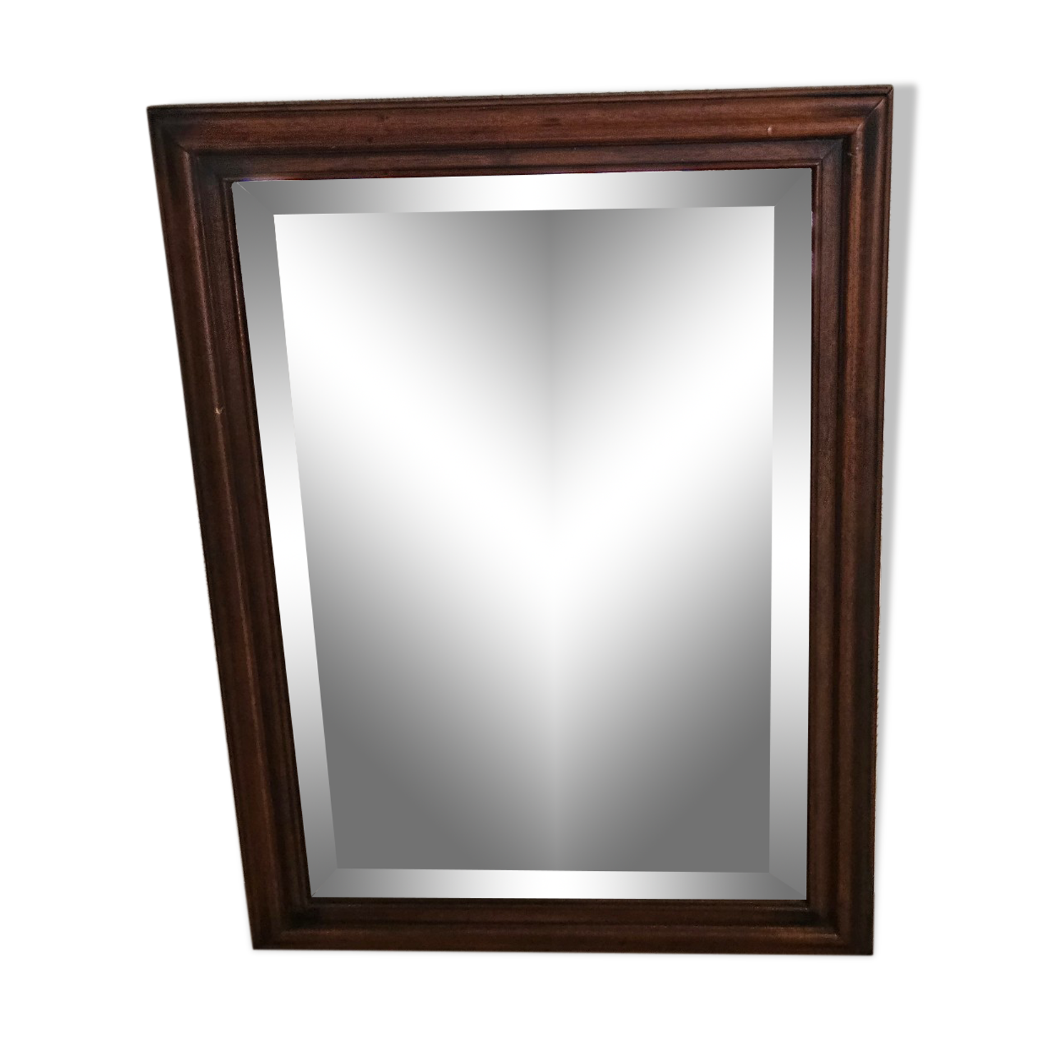 Beveled glass mirror in its wooden frame
