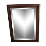 Beveled glass mirror in its wooden frame