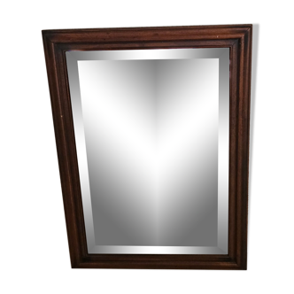 Beveled glass mirror in its wooden frame