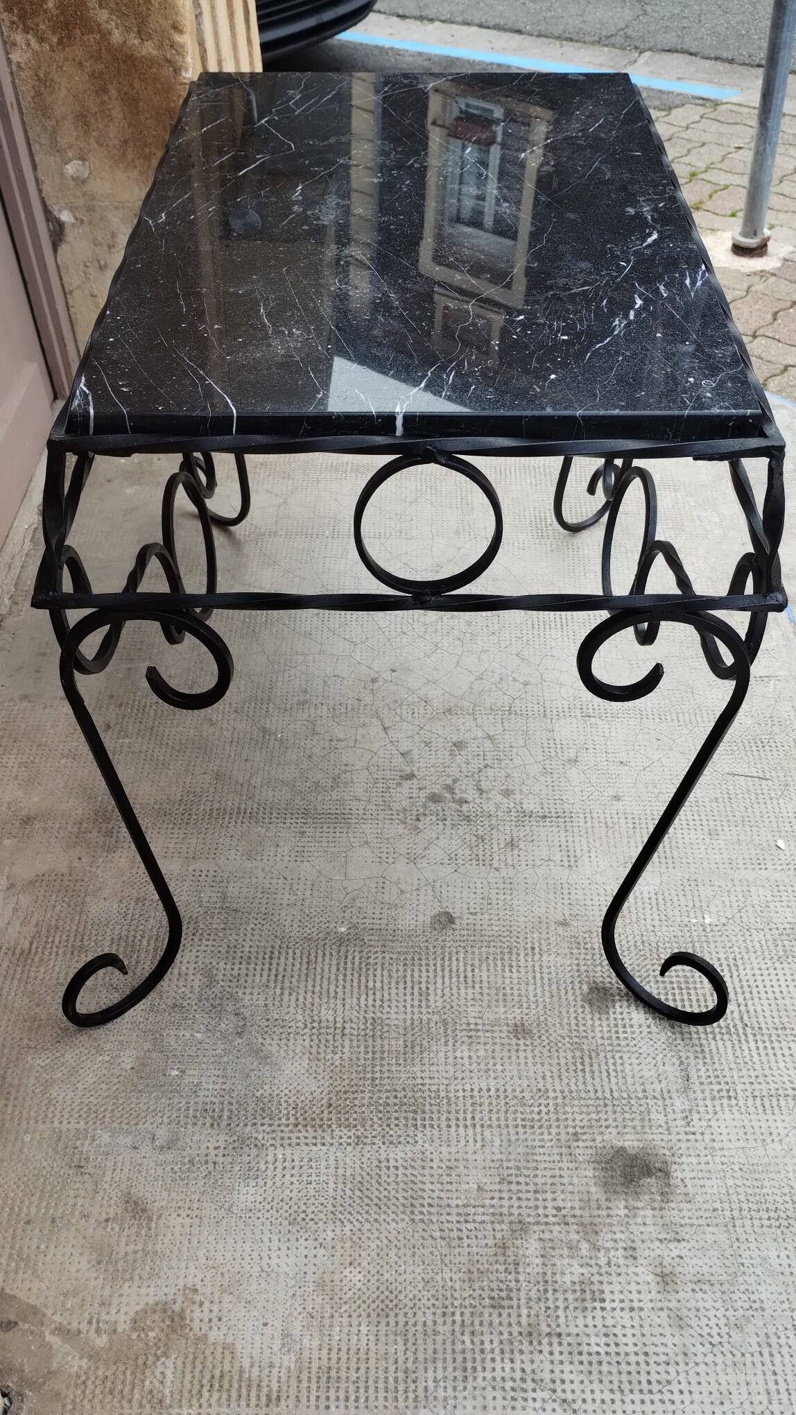 Wrought iron coffee table with black marble top