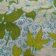 Nappe ronde à décor de fleurs vers 1970