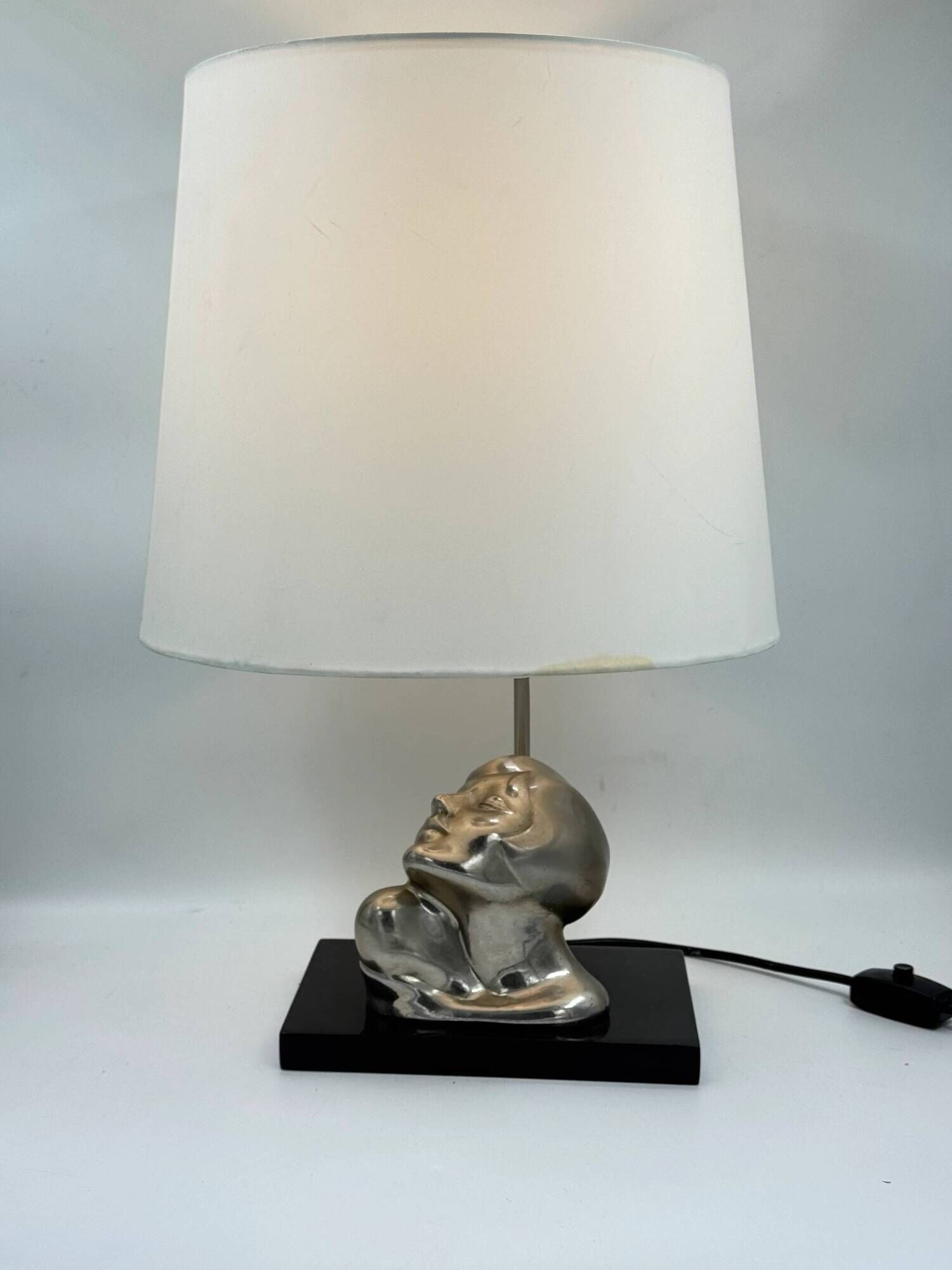 Vintage Art Deco style table lamp, face sculpture, silver-toned bust.