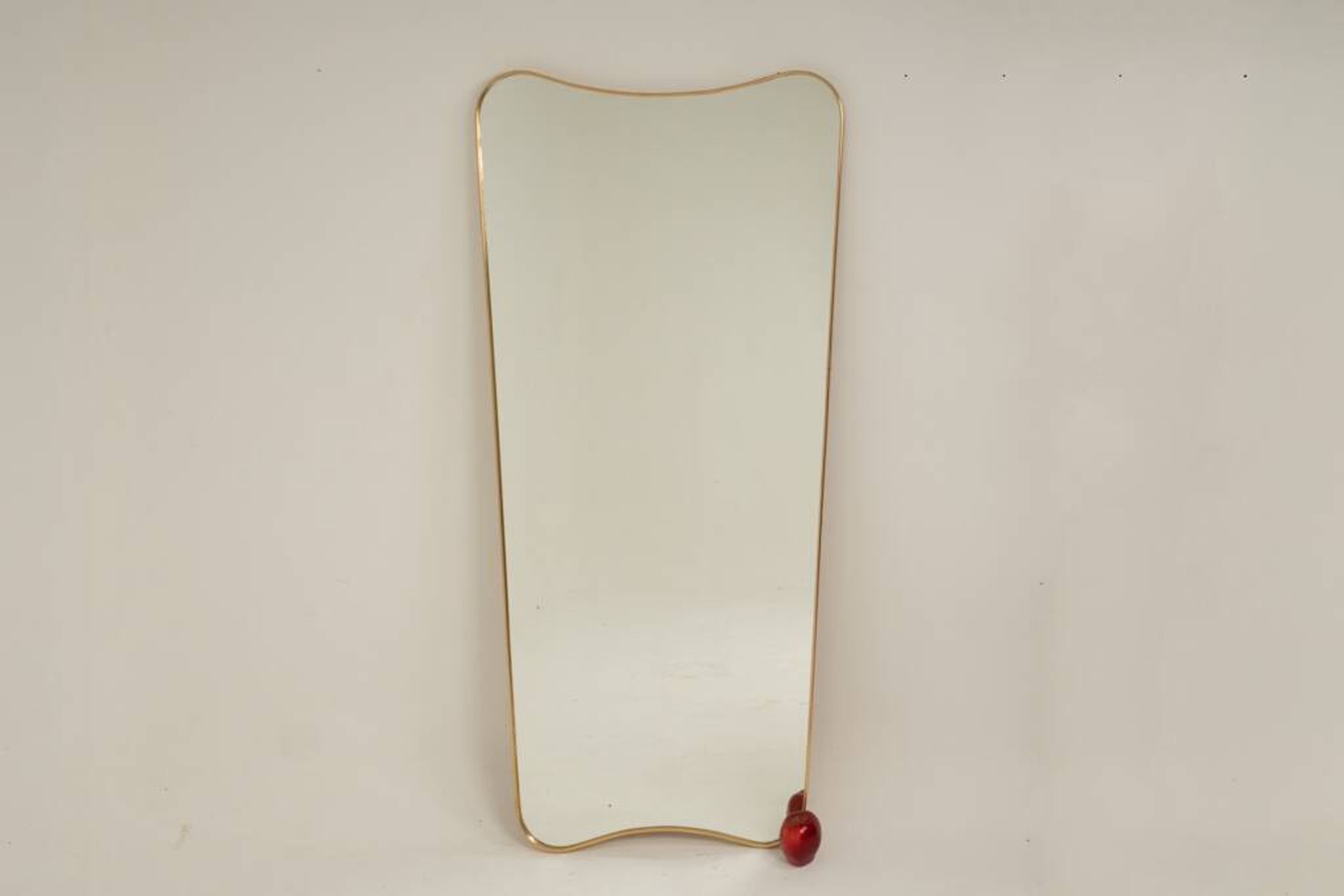 Patinated brass-framed mirror. 1980s/90s.