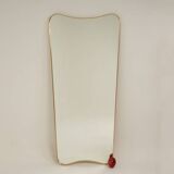 Patinated brass-framed mirror. 1980s/90s.