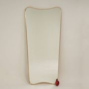 Patinated brass-framed mirror. 1980s/90s.