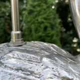 Old vintage lamp representing a duck in silver metal with wooden base