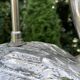 Old vintage lamp representing a duck in silver metal with wooden base