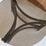 Round coffee table in rattan and smoked glass — 1970s