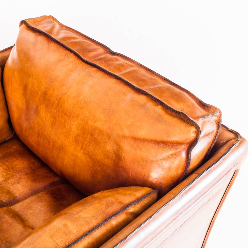 Vintage club armchair by Roche Bobois. Camel buffalo leather. France, 1980s.