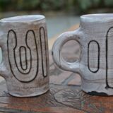 2 ceramic mugs signed db
