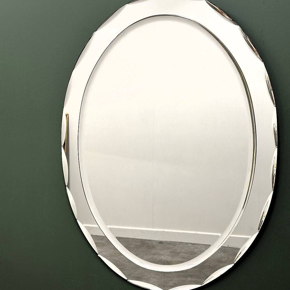 1970s Italian oval mirror by Crystal Arte with faceted glass frame