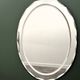1970s Italian oval mirror by Crystal Arte with faceted glass frame
