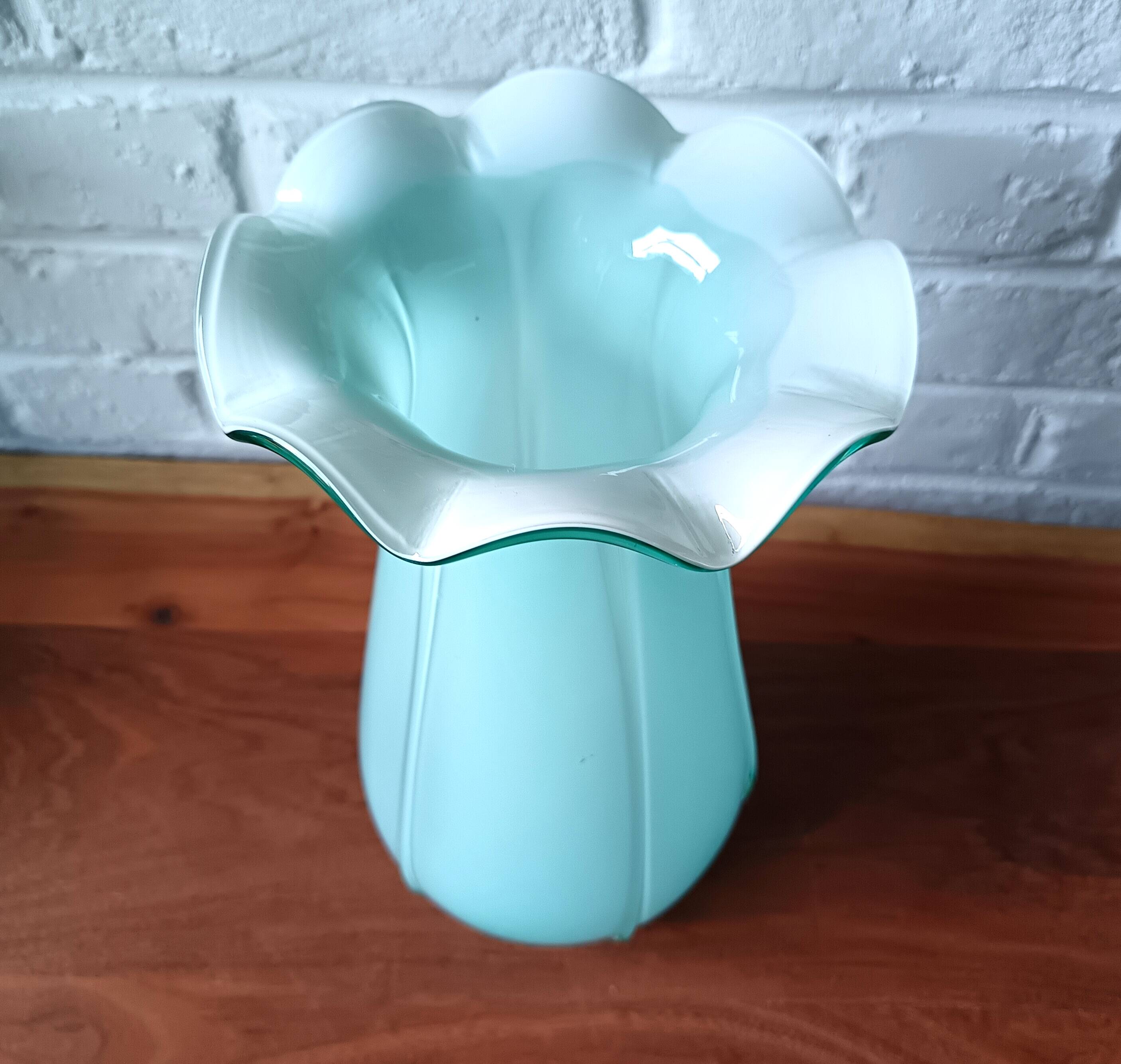 Large light blue opaline vase with a wavy neck.