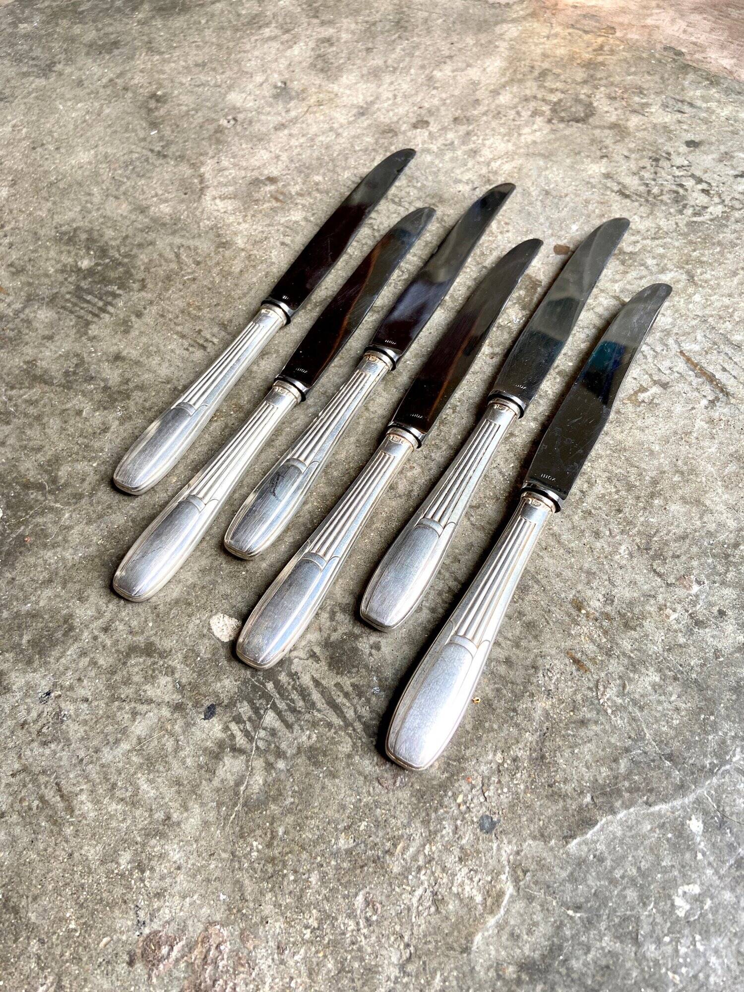 6 silver metal knives