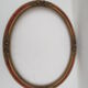 Old oval wooden frame, featuring 8 stucco roses