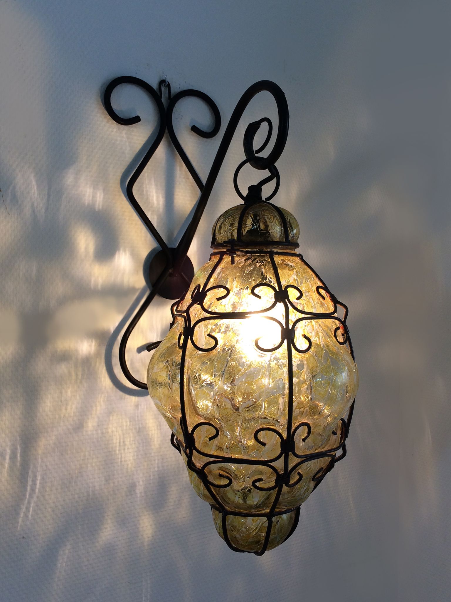 Italian vintage wall lamp in yellow blown glass and wrought iron. Year 70 80