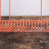 Vintage shelf in red openwork metal